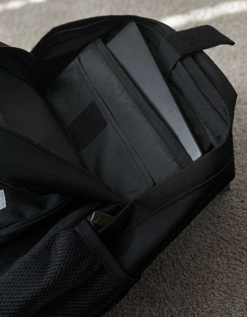 Interior of BMS Carhartt Backpack 27L featuring padded laptop sleeve and secure strap, perfect for protecting electronics during travel.