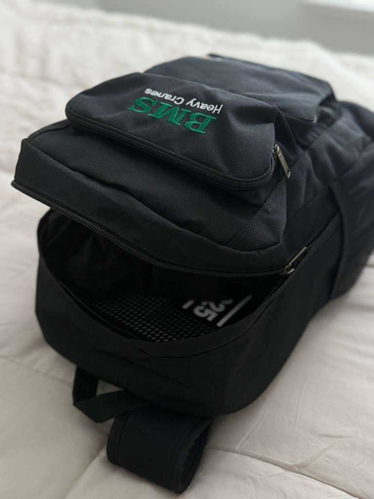 Open BMS Carhartt Backpack 27L showing spacious main compartment with visible Carhartt branding, designed for organized work gear storage.