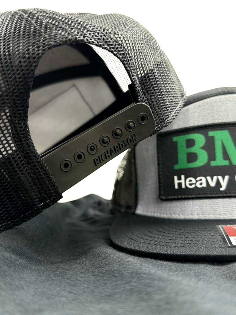 Close-up of BMS Trucker Hat's adjustable snapback closure and mesh back, highlighting Richardson branding and durable jobsite-ready design.