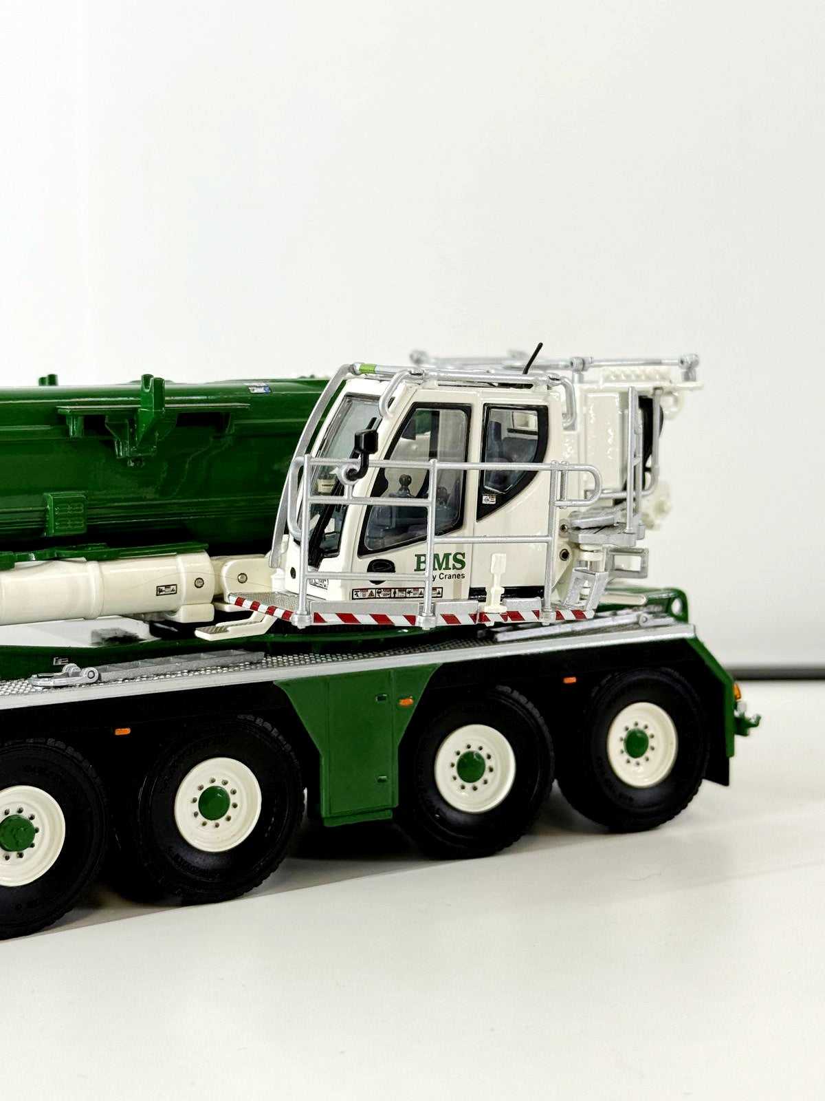 Close-up of BMS Liebherr LTM 1650 model crane cab showing intricate detailing and realistic design in 1:50 scale for toy truck and construction vehicle collectors.