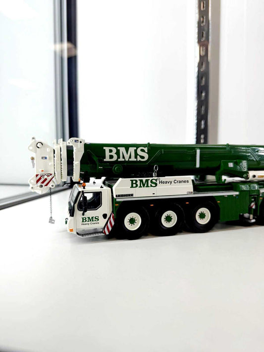 1:50 scale BMS Liebherr LTM 1650 model crane in green and white with detailed carrier and telescopic boom, ideal for collectors and crane enthusiasts.