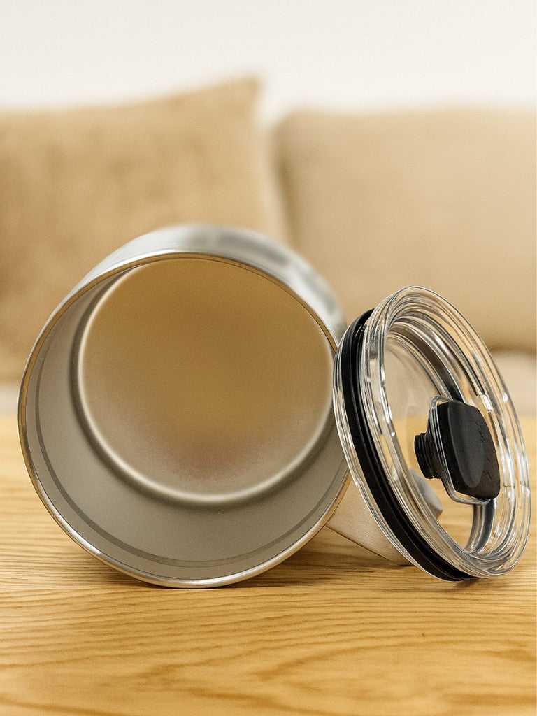 Bottom view of BMS YETI 14oz stainless steel insulated mug with removable lid, showcasing its wide base and durable construction.